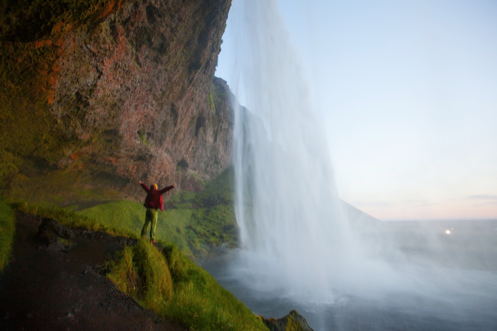 Visitor at Seljalandsfoss waterfall in Iceland